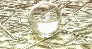 crystal ball on sheets of dollar bills