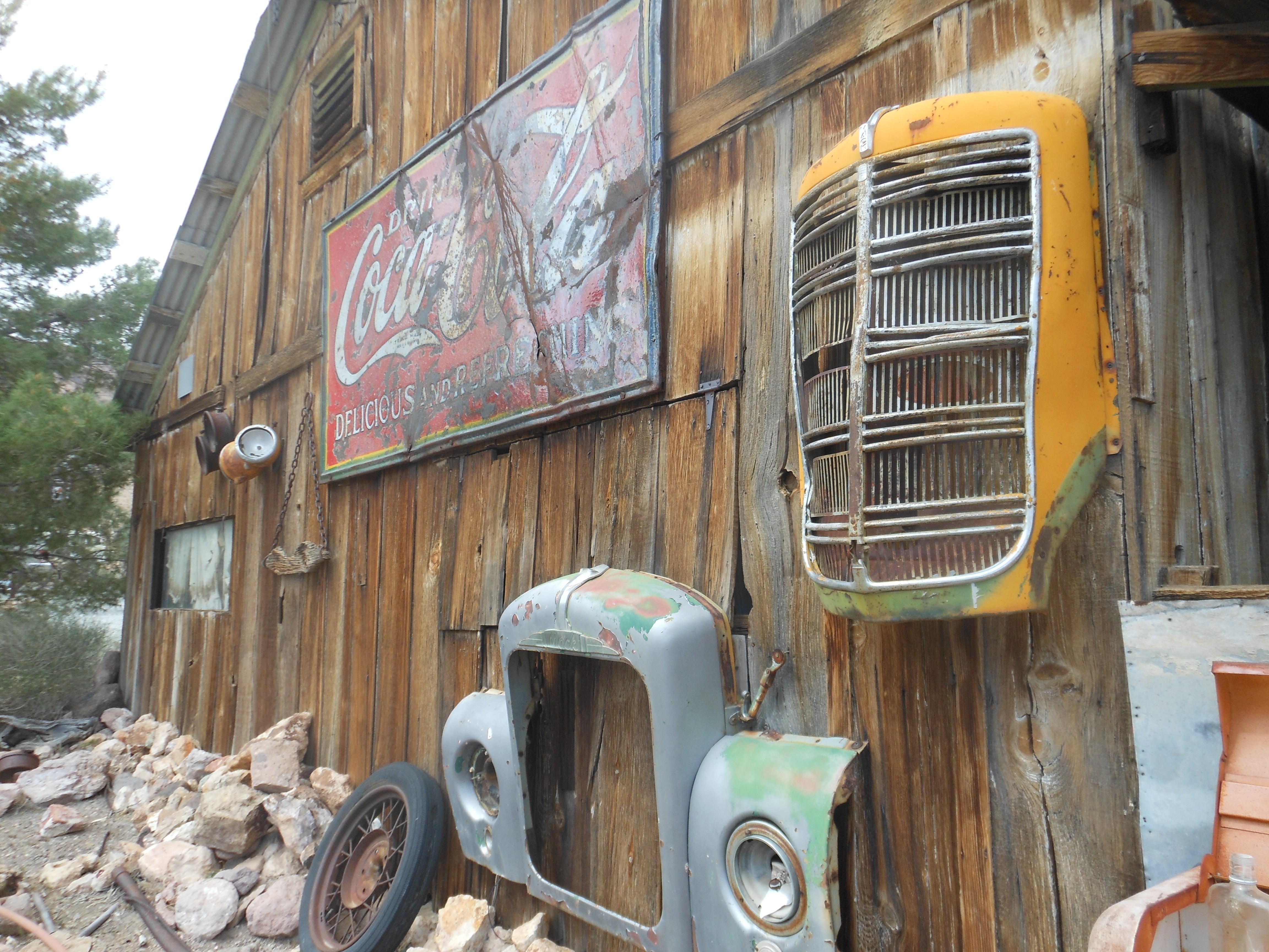 Picture of artfully arranged junk on a barn wall