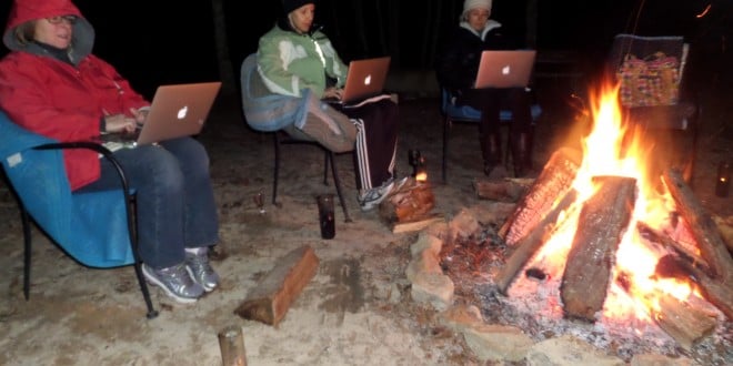 Writers with their Mac's around the campfire
