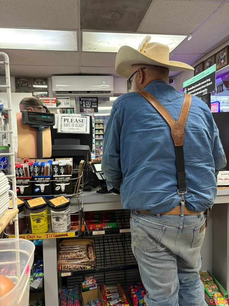 man in cowboy hat at convenience stoor